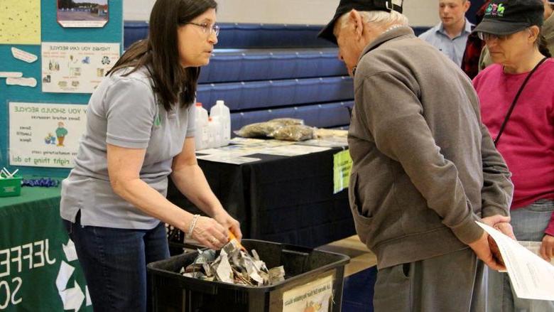 A representative from the Jefferson County Solid Waste Authority shares information, and demonstrates, important aspects of worm composting with community members in attendance at the Earth Day Celebration at Penn State DuBois.