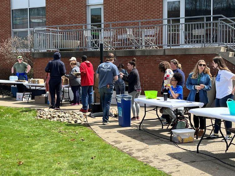 Students and community collaborate on the DEF lawn for an Earth Day celebration